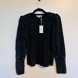 NWT Sewn + Seen black puff sleeve top with button details on the cuffs.